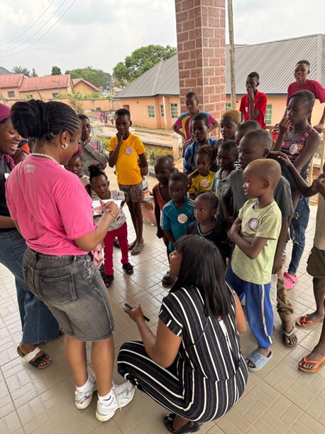 Volunteers teaching children about health topics