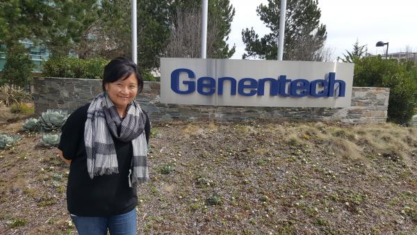 Eileen Yang, MS '00, poses in front of Genentech.